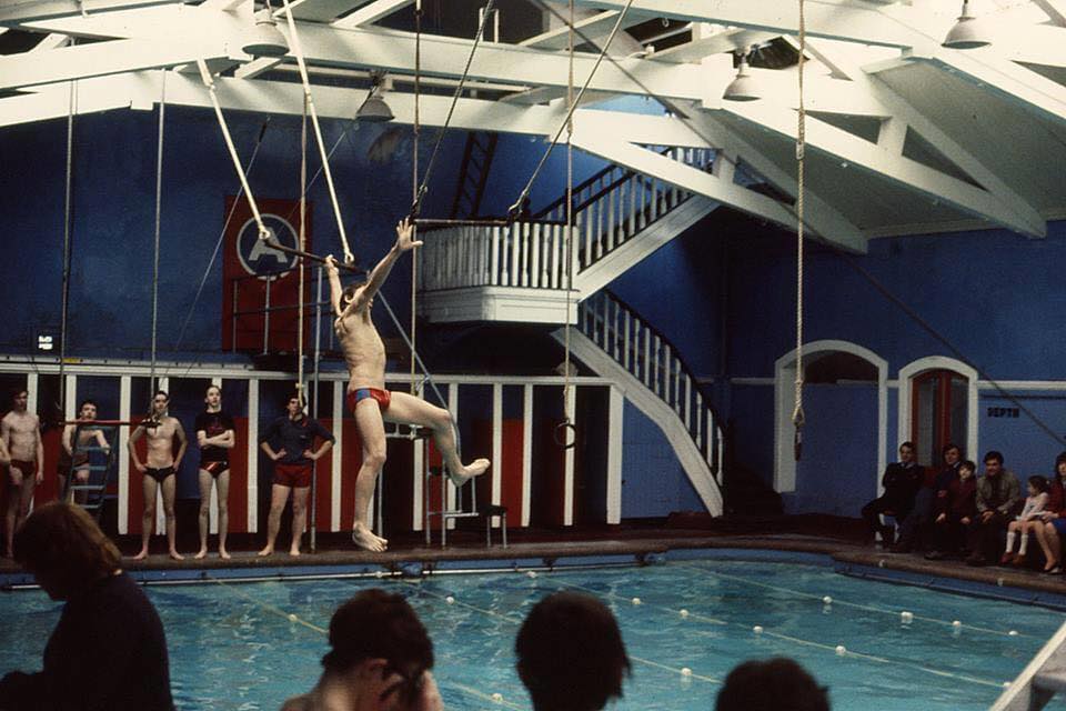 boy swimming trapeze
